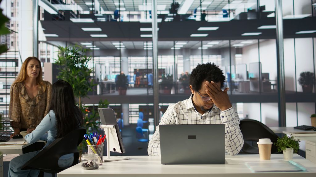 overworked frustrated employee faces migraine from pressure 1 1